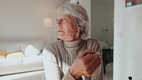 Happy senior woman relaxing at home, enjoying a warm cup of coffee or tea. Natural lighting and cozy atmosphere create a sense of peace and tranquility. - Powered by Shutterstock - Get 15% off with code: PIKWIZARD15