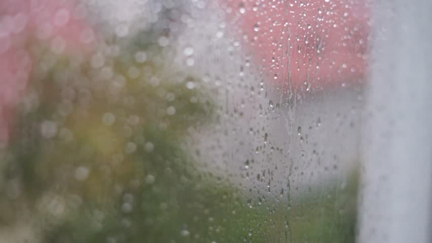 video rain drops on window glass, water, liquid, wet, loop background, condensation on glass, rainy weather home autumn 