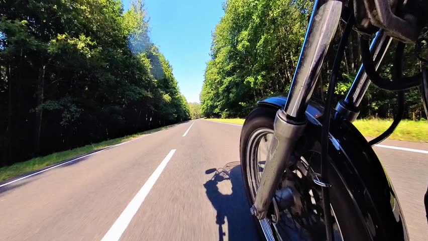 Motorcycle ride through forest road | Wheel turning to roadside | 4K