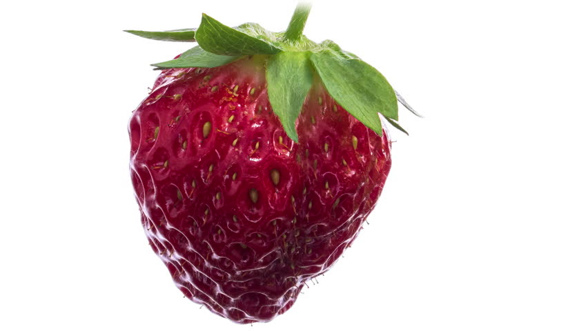Time lapse of ripening strawberry on light background