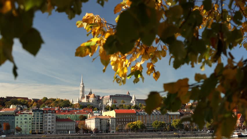 Budapest landscape video. Wide angle film with Budapest castle, Matthias Church and other landmarks of the city with Danube in foreground during an autumn day. Travel to Hungary. 4k video