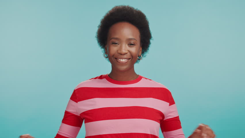 Woman, face and laughing arms crossed in studio for funny joke, comic story and fun personality. Mockup space, black person and happy in portrait with confidence and cheerful humor on blue background