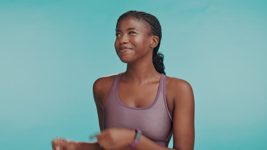 Black person, fitness or face in studio with pointing, sports announcement or happy with space. Personal trainer, excited or showing gesture on blue background for gym sign up promotion or membership