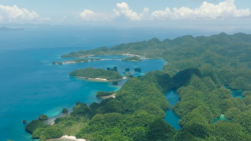 Bucas Grande Island. White beach near Sohoton Bay. Deep blue sea under clear blue sky. Surigao del Norte. Mindanao, Philippines.