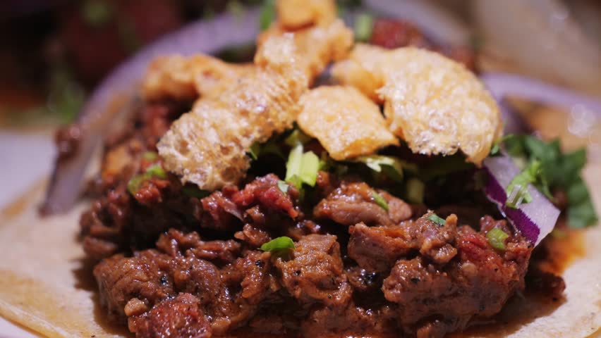 Traditional Mexican food tacos with vegetables and meat close-up. High quality 4k footage