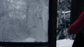 Woman comes into house on winter day after snow medium 4k shot selective focus - Powered by Shutterstock - Get 15% off with code: PIKWIZARD15