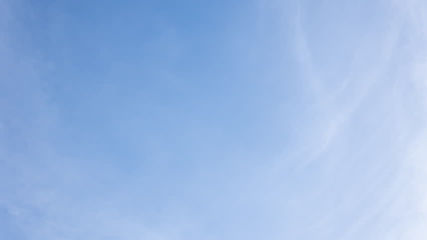 White clouds moving fast from right to left time-lapse. Daylight cloudy heaven background. Long timelapse light clouds transforming in blue sky with motion blur. Perfect for text, titles, logo