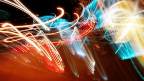 Timelapse flickering light trails. Blurry colorful city streak lights glowing at night, long exposure transformations bright multicolored street illumination. Curved lines change with strobe effect - Powered by Shutterstock - Get 15% off with code: PIKWIZARD15