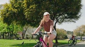 Woman rides rental bike on Buyukada Island, explores urban scenery. Female cyclist enjoys leisure ride, historic architecture, rich green surroundings. Casual biking trip, eco-friendly travel. - Powered by Shutterstock - Get 15% off with code: PIKWIZARD15