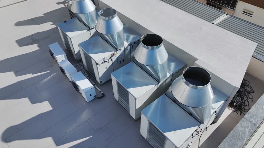 Aerial Video View of Industrial Air Conditioning Units on a Commercial Building Roof