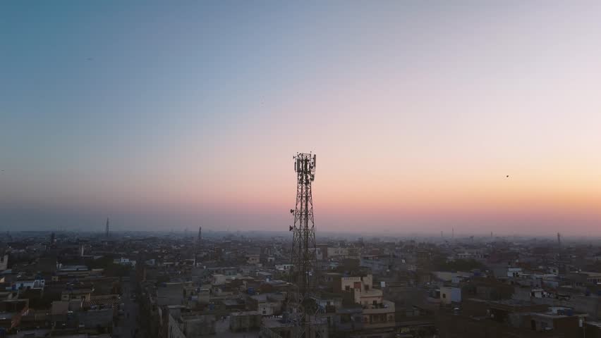 Aerial drone view of tower antennas Telecommunication cell phone, radio transmitters of cellular 5g 4g 3g mobile and smartphones. Footage 4k B Roll 