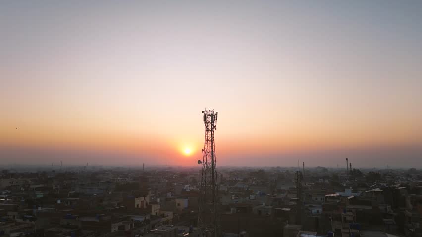 Aerial drone view of tower antennas Telecommunication cell phone, radio transmitters of cellular 5g 4g 3g mobile and smartphones. Footage 4k B Roll 