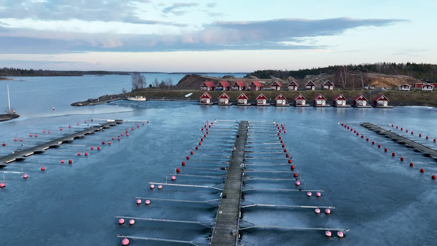 Frozen marina docks during winter at sunset