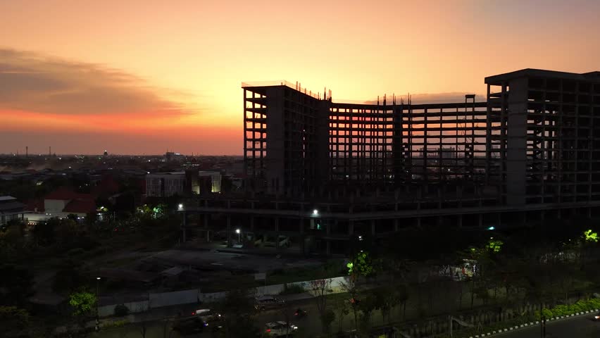 Aerial Shot of Sunset Through Unfinished Building