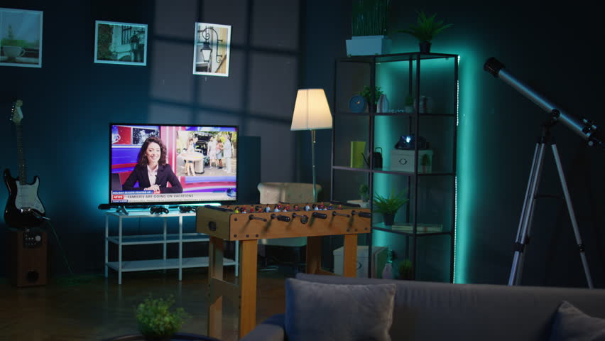 Modern apartment loft with a cozy corner and trendy furniture, comfy space decorated with electronics and a coffee table. Empty studio living room with minimalist decor, chill lifestyle.