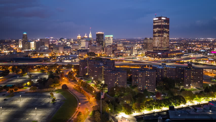 Buffalo, New York, USA downtown city skyline at night from over Lake Erie.