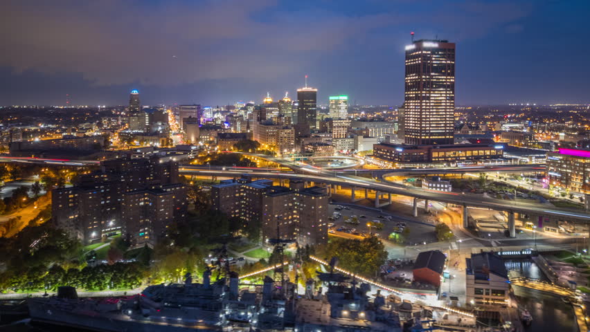 Buffalo, New York, USA downtown city skyline at night from over Lake Erie.