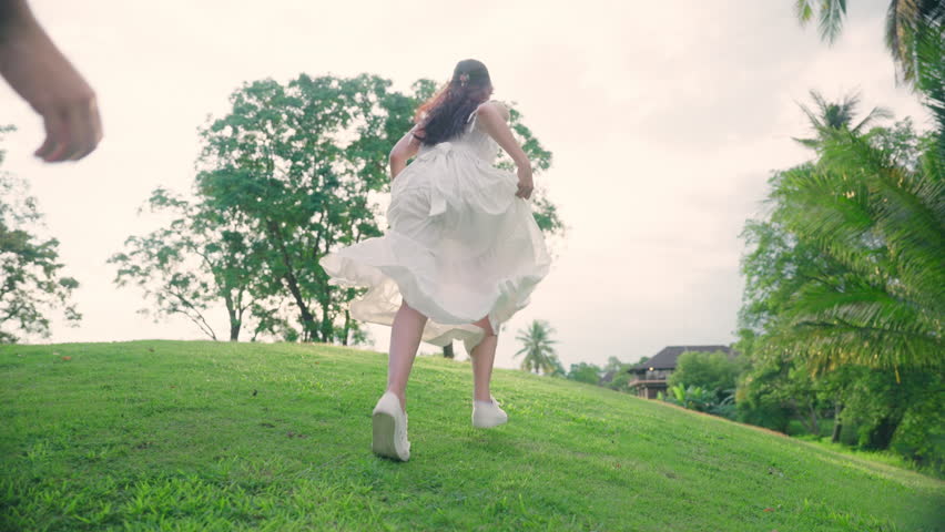 Young adult asia people happy lover flirt at public nature park falling in love desire kiss hug beloved care trust. Sweet asian lovers tender face to face man woman smile relax warm time date day.