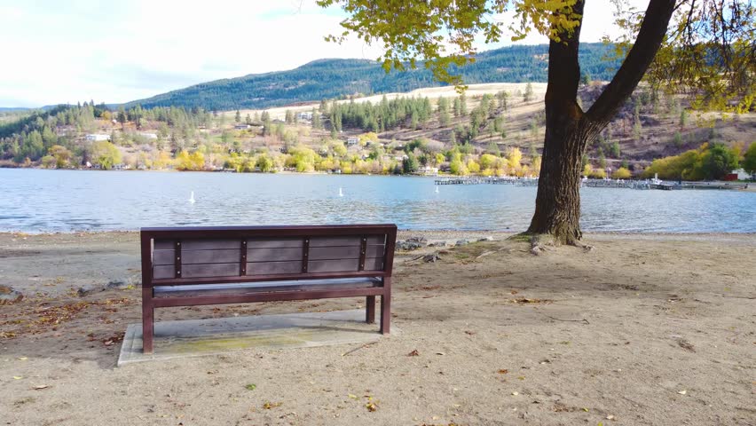 Fall Season Nature Walk in the Park Along Beach. Autumn Leaves on Lake Shore. Wood Lake, Lakecountry, Okanagan, British Columbia, Lake. Quiet Tranquil Nature Scene. Peaceful Calming Serene Outdoors.