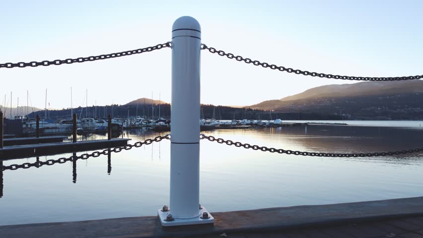 Yacht Club, Marina, BoardWalk Waterfront View. Downtown Kelowna Marina, British Columbia, BC, Canada. Calm Okanagan Lake Looking Towards West Kelowna. Evening Sunset, City Park Walking Path
