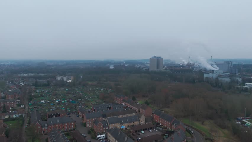 Bury st edmunds, featuring residential areas and distant industrial buildings, aerial view