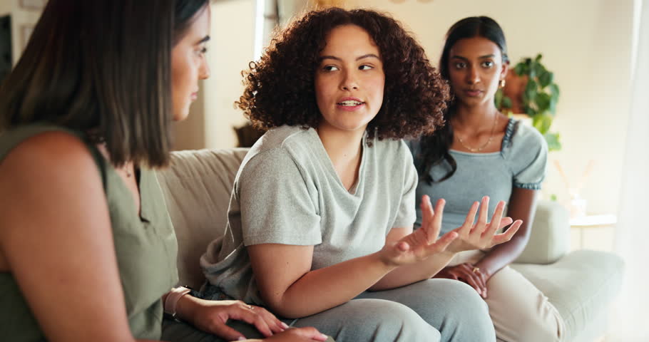 Friends, talking or women in home together for support, comfort or help with depression. Girls, students or group conversation in living room for exam fail, sad story or bad news in college apartment
