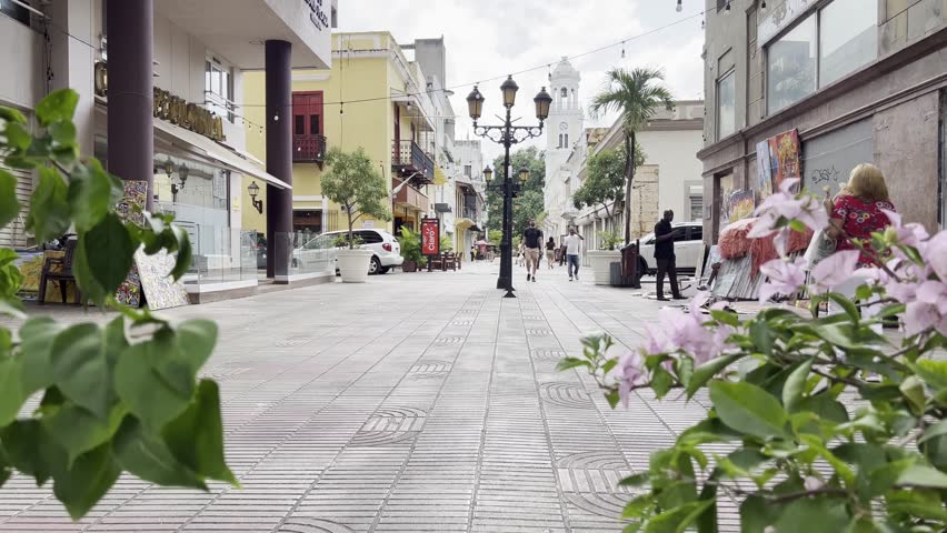 Santo Domingo , Distrito Nacional , Dominican Republic - 08 05 2024: Pedestrians walking along the popular shopping street Calle El Conde in the historic Zona Colonial in the capital city of Santo Dom