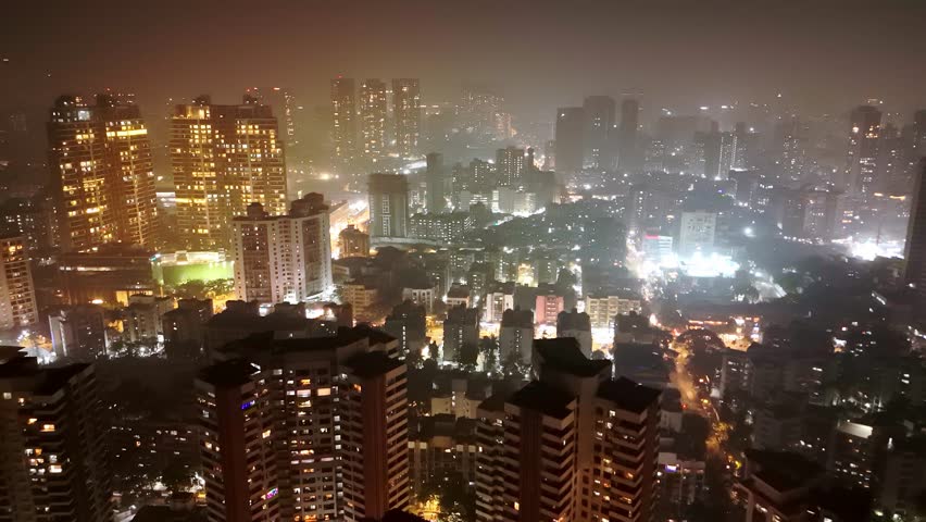 Aerial view of a radiant skyline with luminous towers, Drone shot shimmering metropolitan Mumbai city at night, Dazzling highrise buildings, Cityscape glows under the midnight sky, Skyscraper twinkles