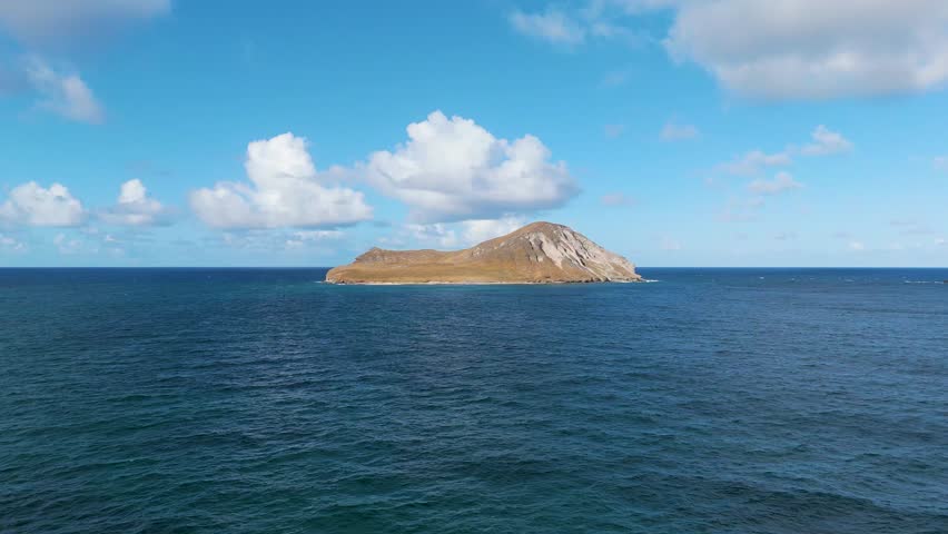 Aerial view of serene Manana Island and Rabbit Island surrounded by tranquil ocean waters, Waimanalo, United States.