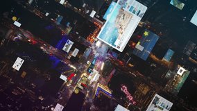 Aerial views of Times Square capture nighttime atmosphere, featuring digital overlays of data and social media icons, blend of technology and urban life in New York City - Powered by Shutterstock - Get 15% off with code: PIKWIZARD15