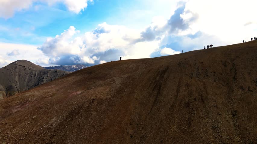 Aerial view of landmannalagur mountains under a dramatic sky with clouds, Hella, Iceland.