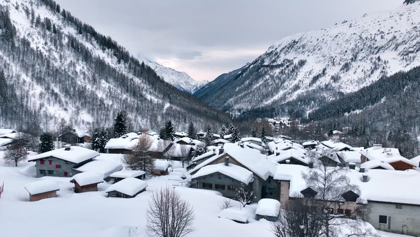 Winter mountain village in French Alps, aerial view of snowy Chamonix, frosty landscape of a ski resort in Europe