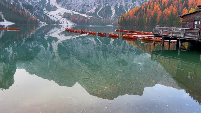 Beautiful lake in the Italian alps, Lago di Braies in autumn. Italy