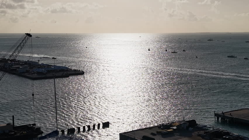 Drone shot of a race boats driving on the shore of Key West, sunny Florida, USA