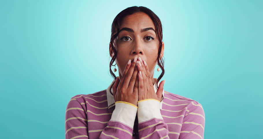 Surprise, news and student with face of woman in studio for college announcement, scholarship winner and decision. University choice, shocked and mockup space with person on blue background for alert
