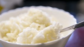 Hot white cooked rice steam bowl kitchen background static. Sticky rice after cooked. Asian Chinese Thai Japanese Indian traditional eateries. Home calm cooking gourmet - Powered by Shutterstock - Get 15% off with code: PIKWIZARD15