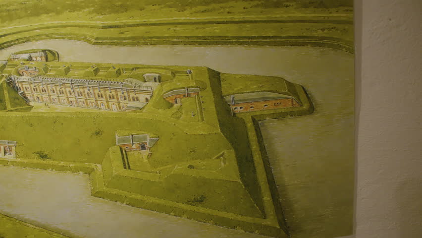 A historical painting depicting aerial view of Fort de Mutzig fortress. Interior of Fort de Mutzig fortress, now a museum.