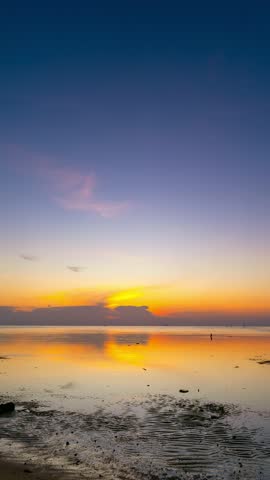 Timelapse of Majestic sunrise landscape, Amazing light of nature cloudscape sky and Clouds moving away rolling colorful dark sunset clouds, Footage time lapse,Nature environment background in vertical