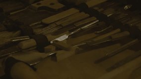 Close up shot of old nineteenth century medical tools, including a saw, pliers, and a pair of tweezers. Exhibition of old medical tools at Fort de Mutzig fortress hospital room. - Powered by Shutterstock - Get 15% off with code: PIKWIZARD15