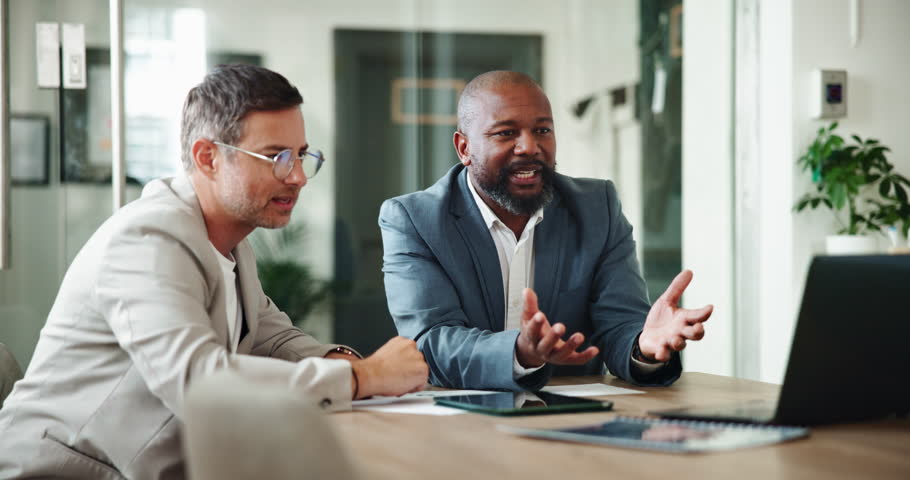 Business men, laptop and training with mentor, coaching team or teaching trading at hedge fund office. Computer, collaboration and discussion in meeting for finance, investment and risk management