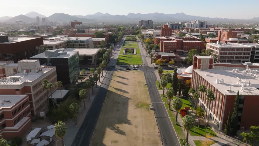 Tucson , Arizona , United States - 01 30 2025: U of A Mall Seen by Drone, Aerial Shot of Beautiful Campus and Walkway with Mountains on Horizon
