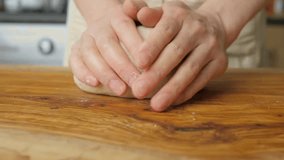 cheff Hands kneading dough on table preparing bread pastry yeast flour Cooking food concept background slow motion - Powered by Shutterstock - Get 15% off with code: PIKWIZARD15