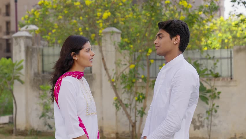 Indian Couple Smiling and Talking to each other