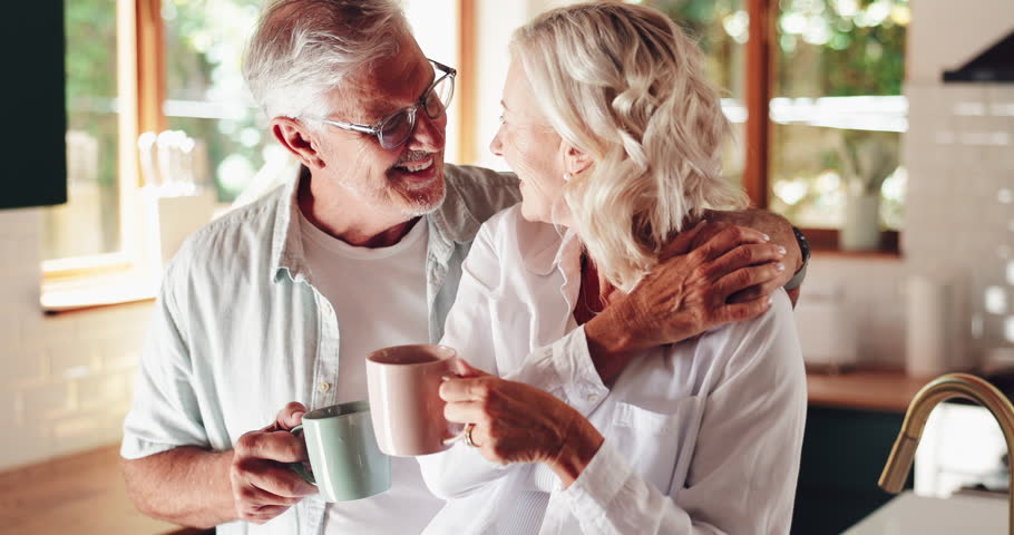 Coffee, senior couple and embrace in home for love, romance and happiness on valentines day. Eskimo kiss, man and woman together for relationship, commitment and marriage in retirement in kitchen