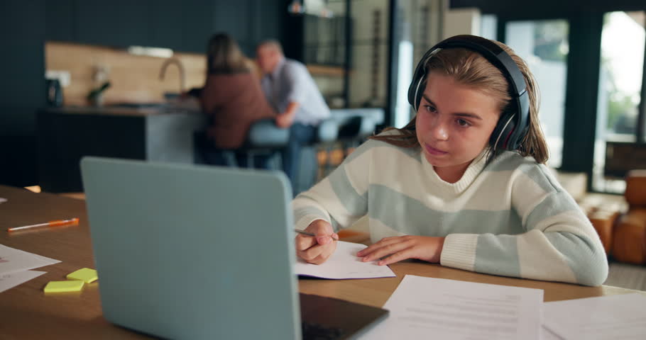 Laptop, homework and child in home with headphones for distance learning, education and lesson. School, writing and teenager listen to audio on computer for online assessment, knowledge and studying