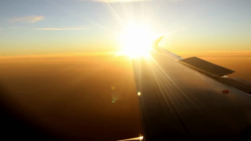 Aerial view of epic dark clouds flying plane camera, Nature landscape in motion. revealing scenic sunset sun setting into horizon. Timelapse, 4K UHD.