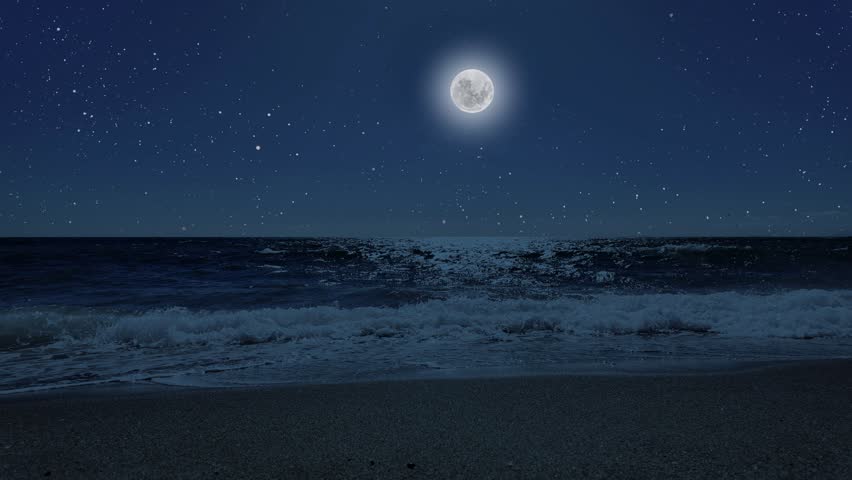 a movement of stars in the night sky with the view of mountains.	