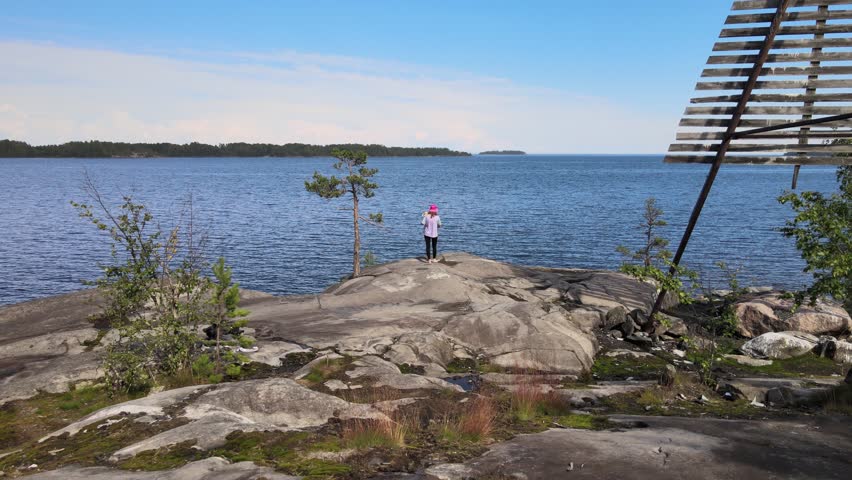 Russia, Lake Onega. View of the coast of the island in a cold lake. Beautiful nature of the Republic of Karelia. Panoramic view from the height of the Ladoga