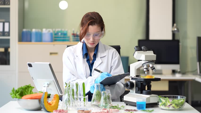 Microbiologists and nutrition experts analyze molecular samples in advanced food science labs, exploring innovations in nutrition, psychiatry, and health science research.