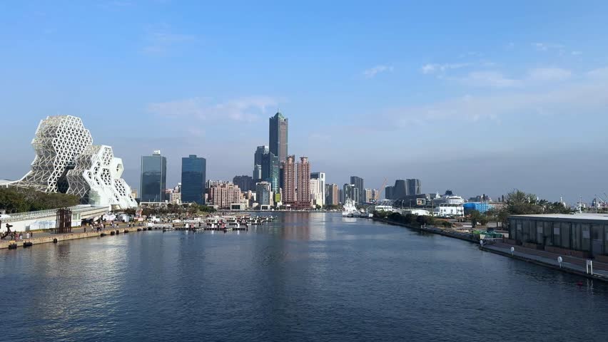 Skyline of Kaohsiung, Taiwan with modern buildings by the water in a vibrant city view